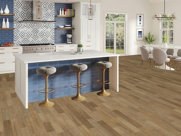 Kitchen with blue tile and medium brown acacia hardwood floors.